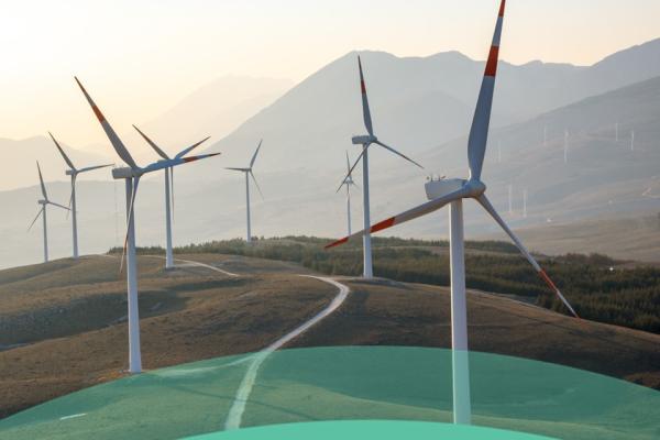 The visual shows a winding road through gentle hills, with mountains in the background. windmills blow on either side of the road. The text at the bottom of the visual reads hashtag repower eu - 2 years on